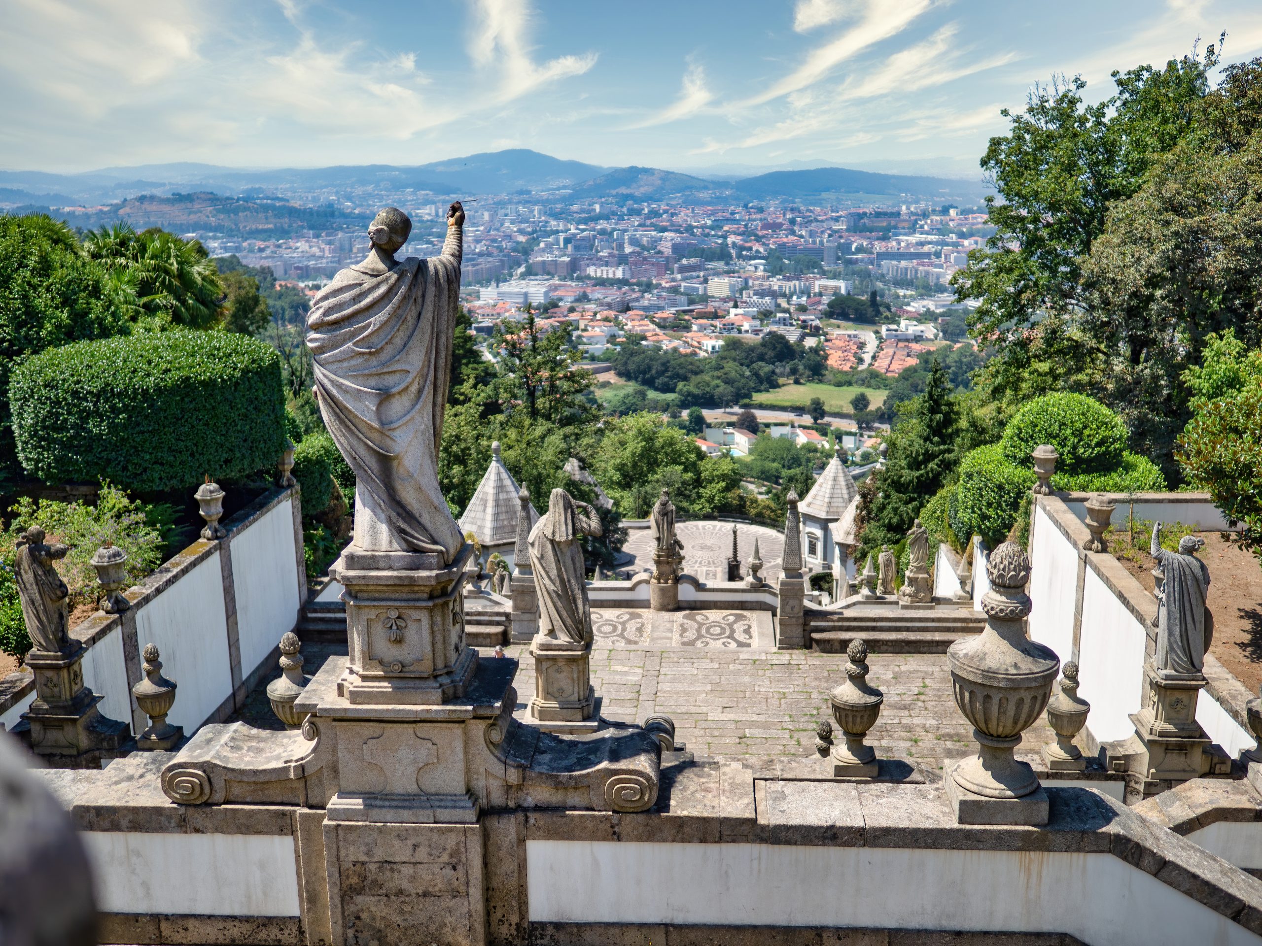 Braga, Portugal - July 22, 2020: Bom Jesus do Monte sanctuary. View from the top. Below is a stairway of almost 600 steps. In the background is the city of Braga.